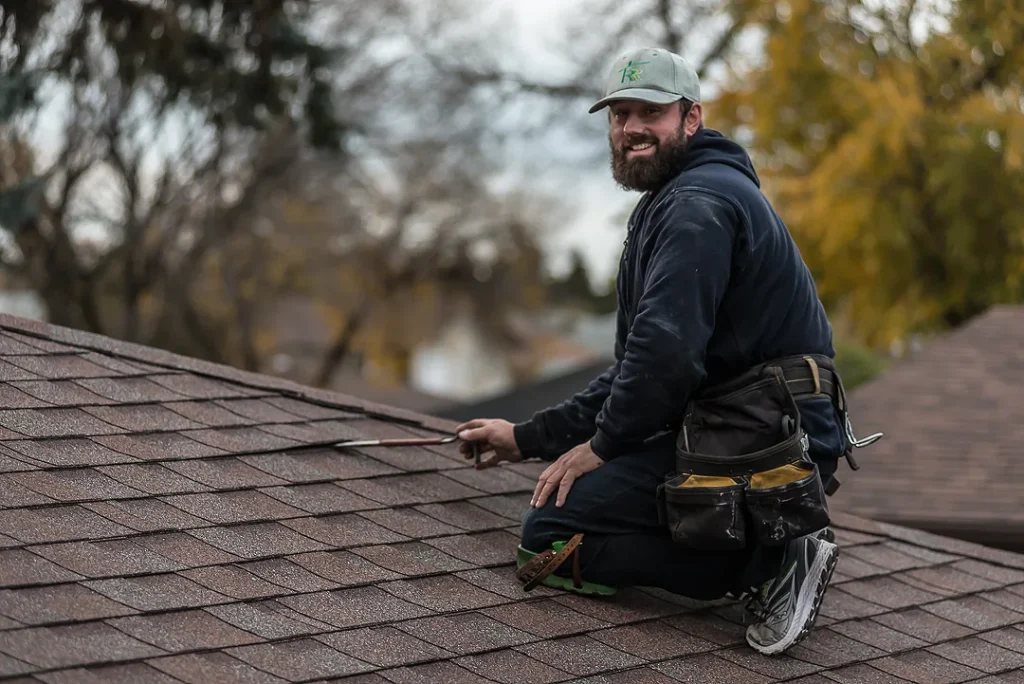 Technician doing a roof shingle repair